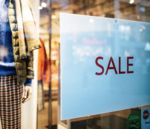 A sale sign in a window